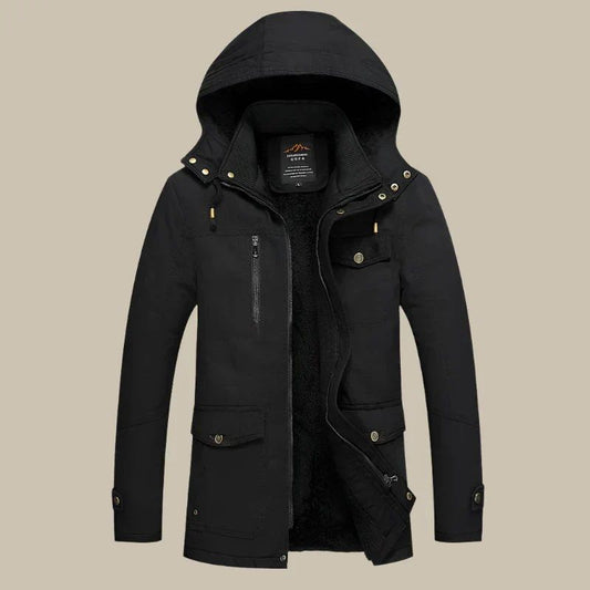 Donkergroene waterdichte winterparka voor heren met warme fleecevoering en praktische zakken, perfect voor koude en natte dagen.






